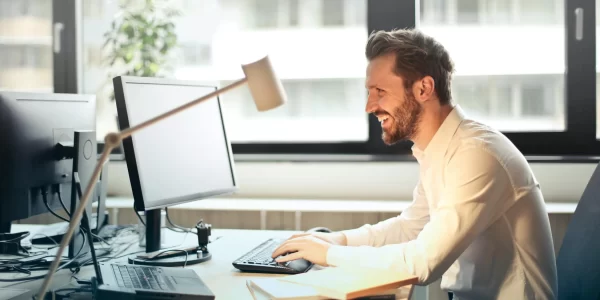 Smiling man at desk