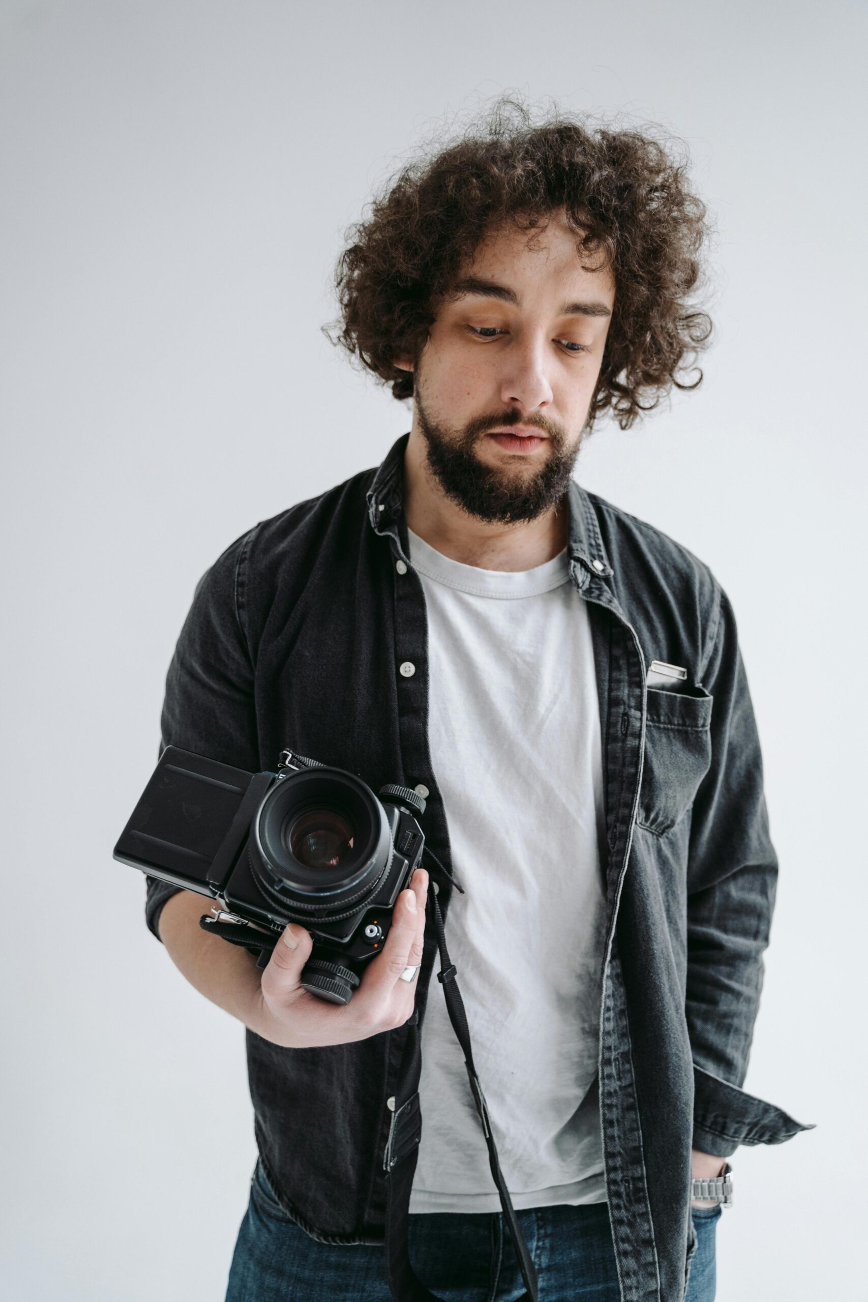 Professional photographer holding a DSLR camera